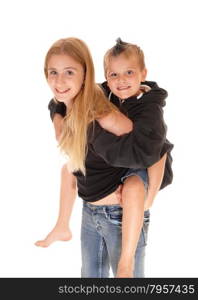 A closeup picture of a young girl caring her little brother on her back,smiling, isolated for white background.
