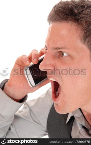 A closeup picture of a young man screaming in his cell phone, with hismouth wide open, isolated for white background.