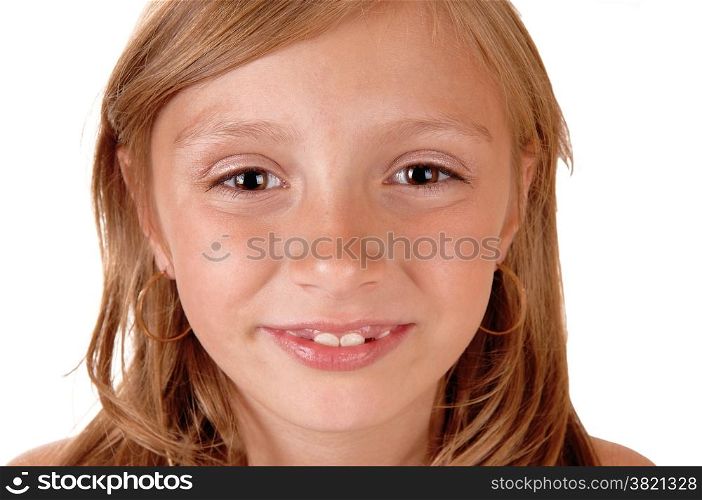 A closeup picture of the face of a eight year old girl, smiling, isolatedfor white background.