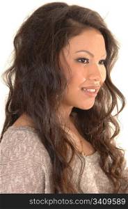 A closeup portrait of a young beautiful Asian woman with long curlybrunette hair, for white background.