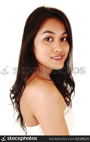 A closeup portrait shoot in profile of a beautiful young Asian womanwith long brunette hair for white background.