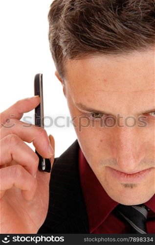 A closeup shoot of a man from the front holding his cell phone on hisear, isolated for white background.