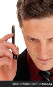 A closeup shoot of a man from the front holding his cell phone on hisear, isolated for white background.