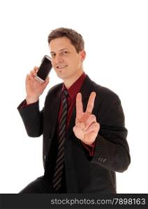A closeup shoot of a man his cell phone on his ear and sign victory withtwo fingers, isolated for white background.