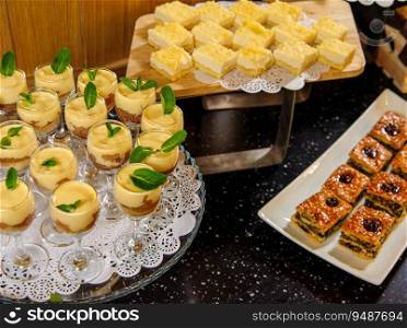 A closeup shot of a buffet table with desserts and sweets. Closeup shot of a buffet table with desserts and sweets