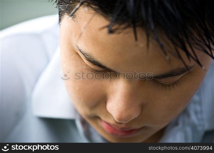 A closeup shot of a depressed asian man