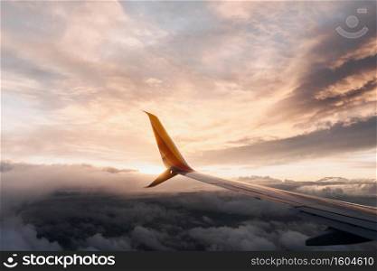 A closeup shot of a plane wing in a pinkish sky. Closeup shot of a plane wing in a pinkish sky