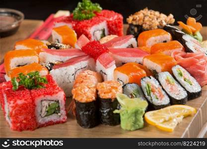 A closeup shot of a sushi set on a wooden plate. Closeup shot of a sushi set on a wooden plate