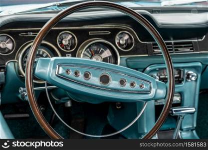 A closeup shot of a turquoise interior of a car, including the steering wheel. Closeup shot of a turquoise interior of a car, including the steering wheel
