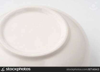 A closeup shot of the underside of a white bowl. Closeup shot of the underside of a white bowl