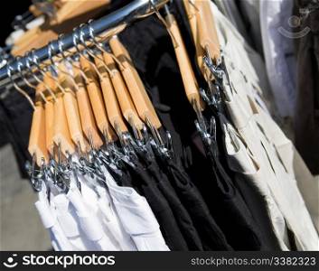 A clothes rack of pants in a store