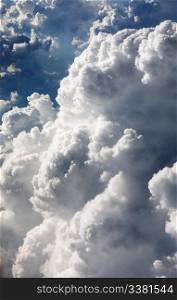 A cloud background with puffy white clouds, taken from above