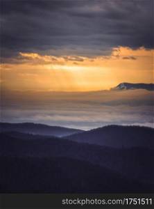 A cloud inversion fills the Shenandoah Valley at sunset with the Massanutten Ski Resort seen in the distance.