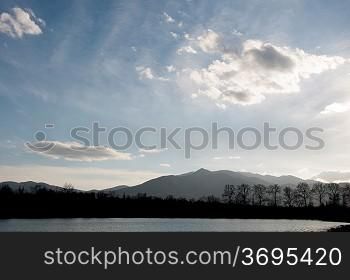A cloudy landscape with mountains