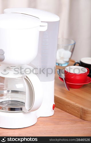 a coffee machine and cups