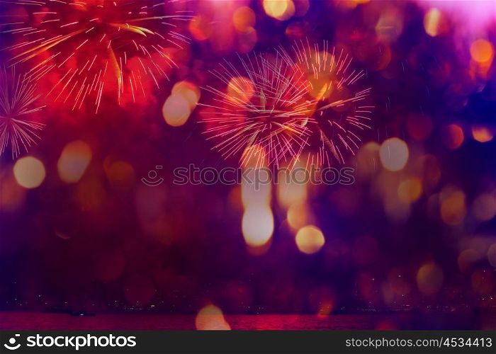 A collage of exploding fireworks in the night. Decorated with light spots. Good for holiday background.