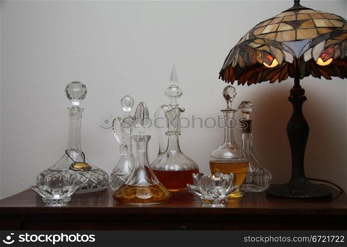 A collection of antique chrystal decanters, filled with liquor
