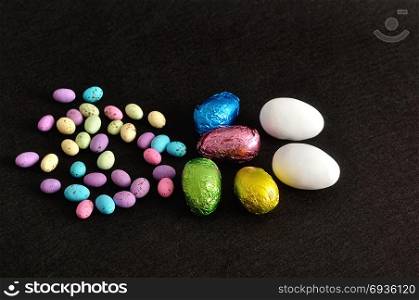 A collection of different easter eggs on a black background
