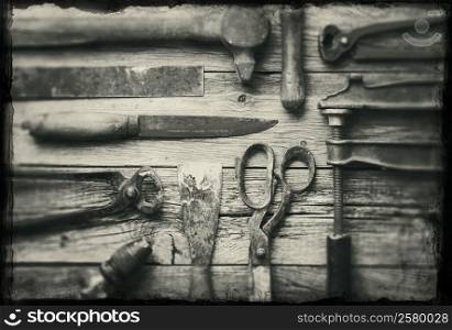 A collection of old rusty tools with grunge borders.