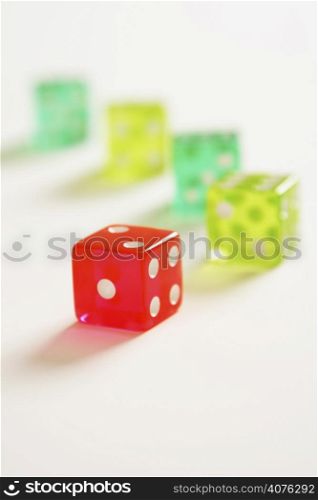 A colorful dice on white (shallow DOF)