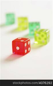 A colorful dice on white (shallow DOF)
