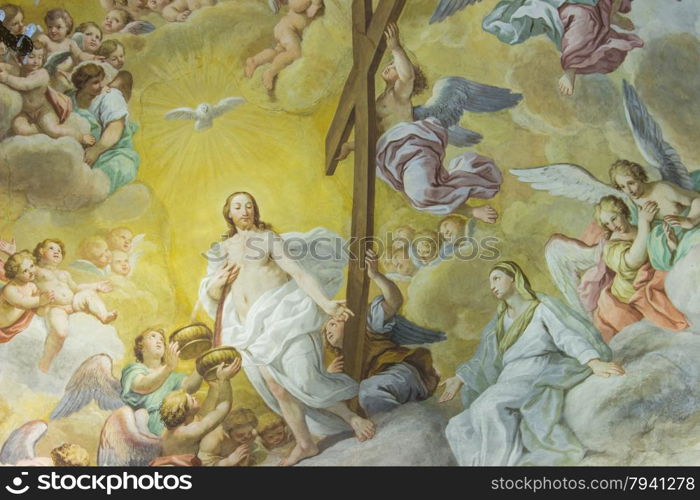 A colorful Italian Renaissance fresco on the arched ceiling of an ancient church.