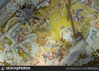 A colorful Italian Renaissance fresco on the arched ceiling of an ancient church.