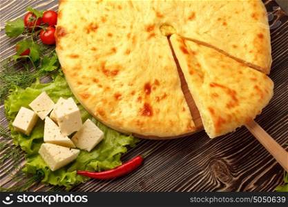 A colorful photo of traditional delicious beef osetinian pie. Traditional Ossetian feta cheese pie still life.