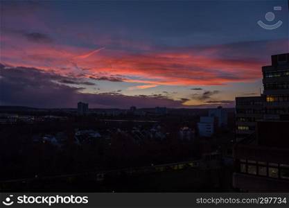 A colorful sundown above a city in Germany