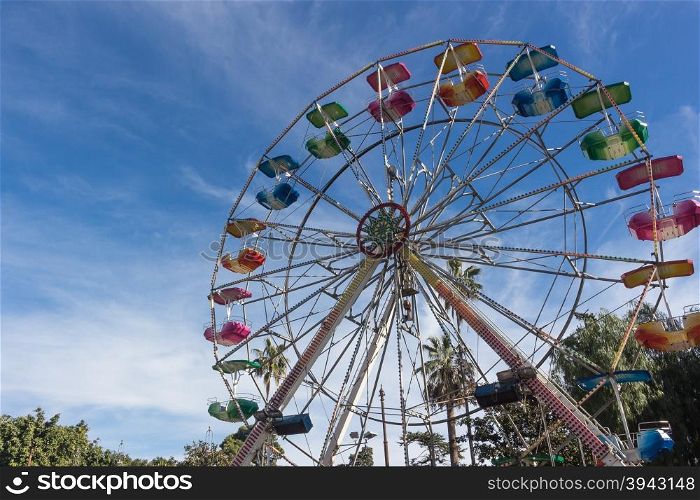 A colourful ferris wheel. Front view
