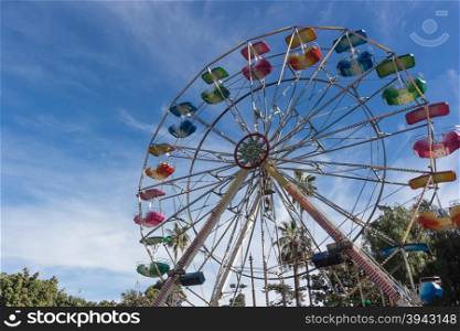 A colourful ferris wheel. Front view