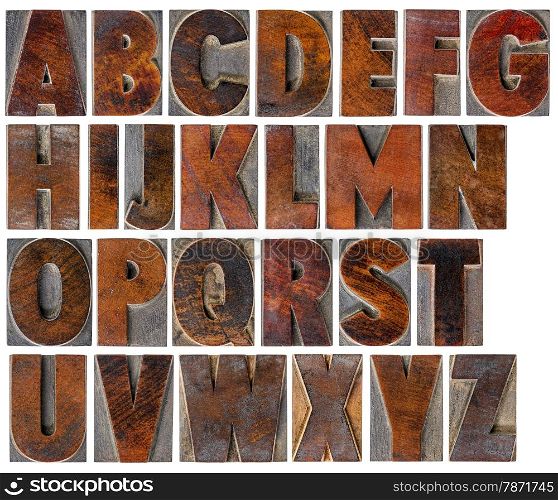 a complete English uppercase alphabet - a collage of 26 isolated antique wood letterpress printing blocks with ink patina
