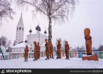 A composition of wooden sculptures on a winter day in the village of Vyatskoe, Yaroslavl Region, Russia.