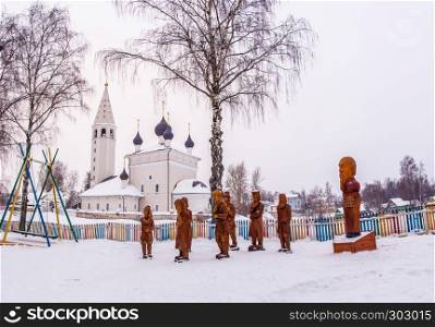 A composition of wooden sculptures on a winter day in the village of Vyatskoe, Yaroslavl Region, Russia.