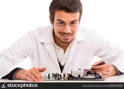 A computer engineer or technician, working on a computer motherboard