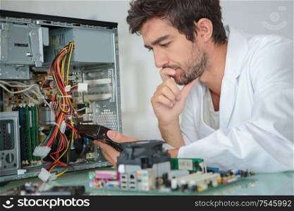 a computer engineer solving the motherboard problem