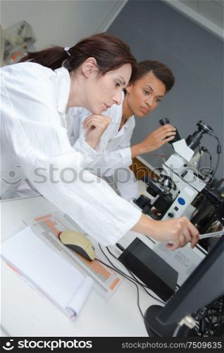 a concentrated young female scientists