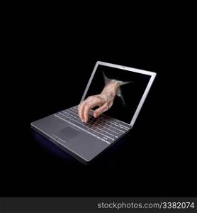 A concept image of a computer hacker attacking a laptop