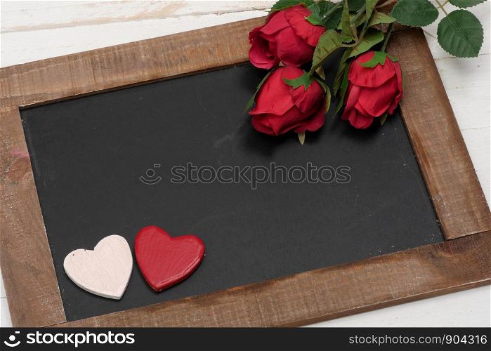 a concept romantic, small chalkboard, roses and heart