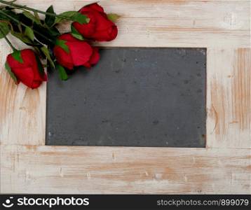 a concept romantic, small chalkboard with three roses