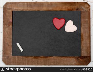 a concept romantic, small chalkboard with two hearts