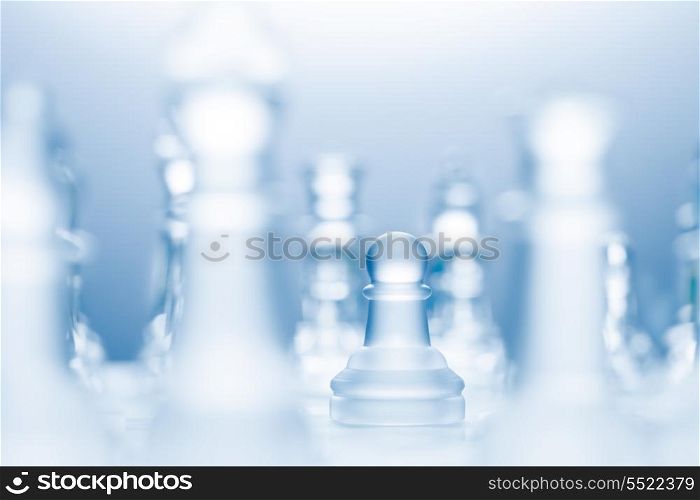 A conceptual photo of a transparent pawn made of glass on a chessboard.