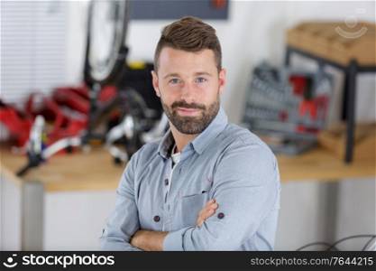 a confident handsome car mechanic