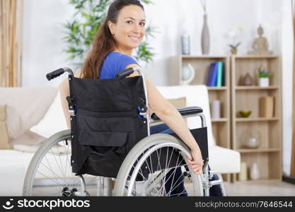 a confident woman with a wheelchair