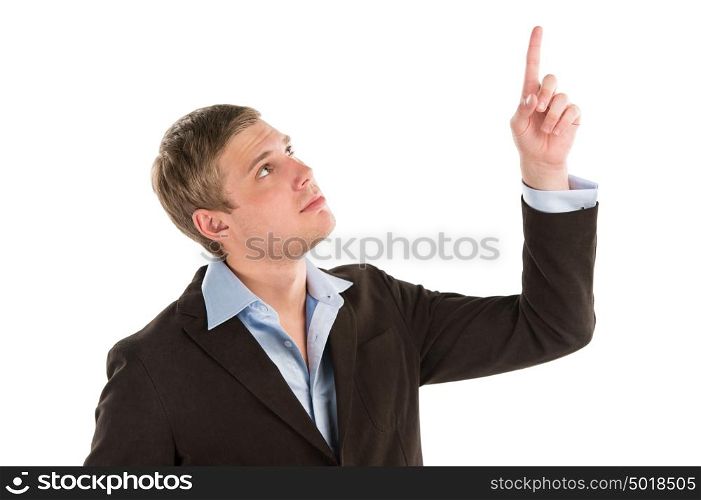 A confident young businessman pointing upwards while isolated on a white background