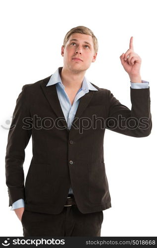 A confident young businessman pointing upwards while isolated on a white background