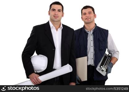 a construction manager and a worker with a tile cutter