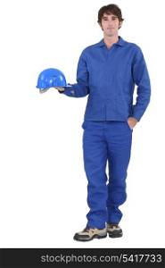 A construction worker dressed all in blue.