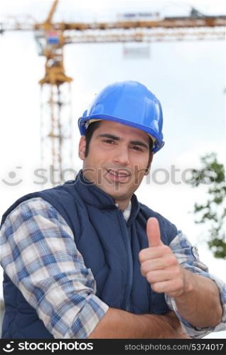 A construction worker giving the thumb up.