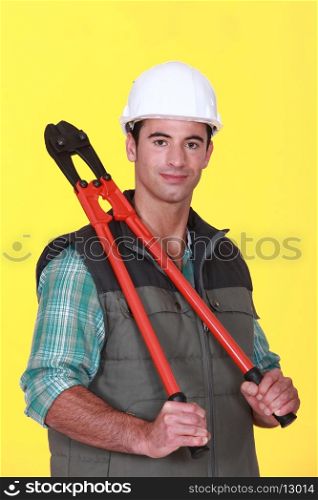 A construction worker holding pliers.